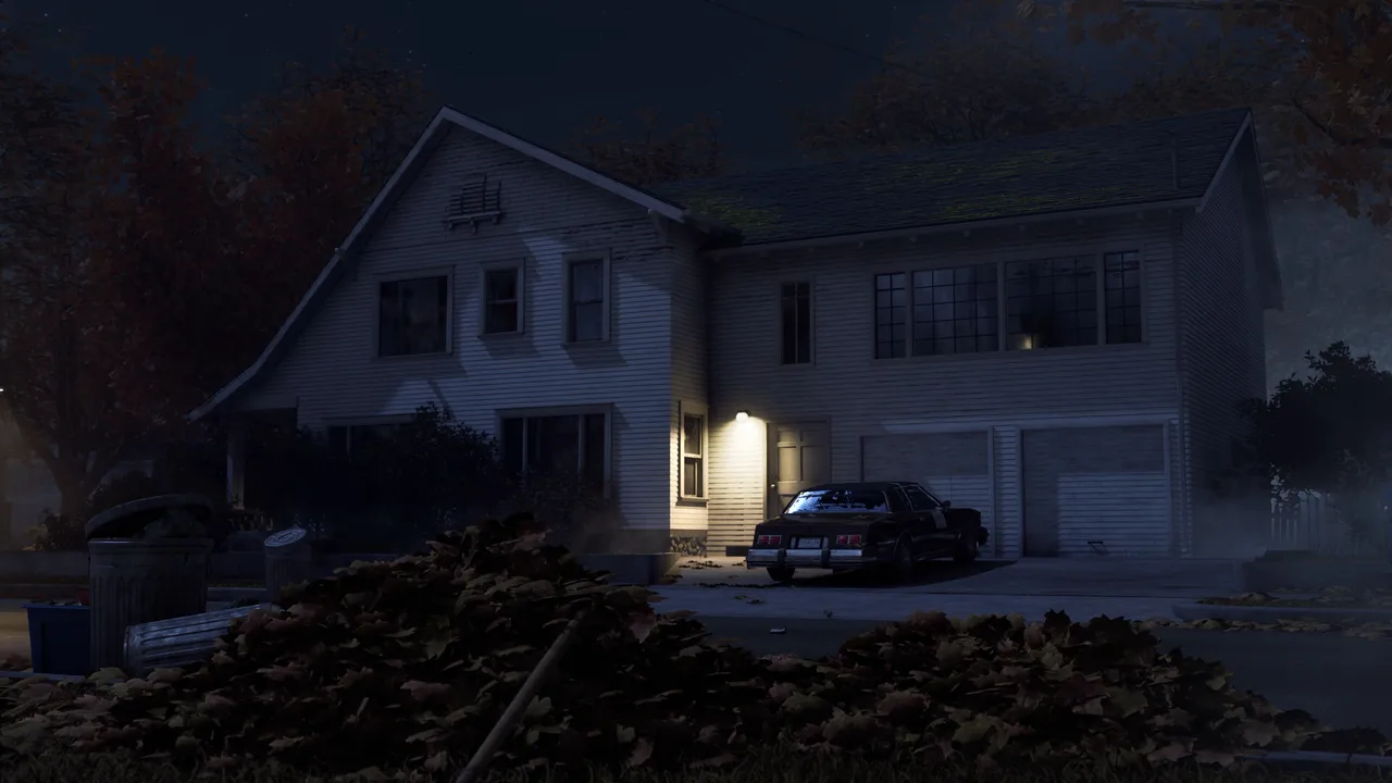 A dark Haddonfield house and police car at night